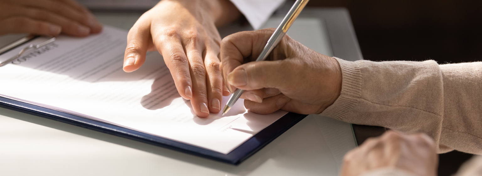 person signing a contract